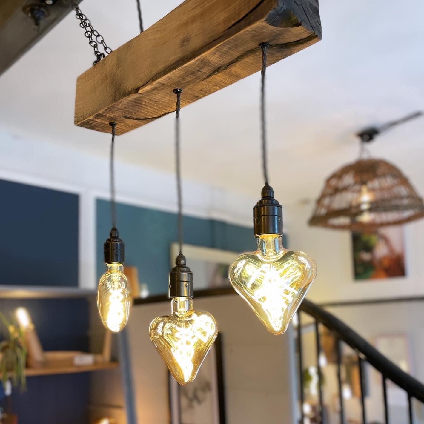 Triple Heartwood Elegance: Oak Chandelier with Three-Bulb Ceiling