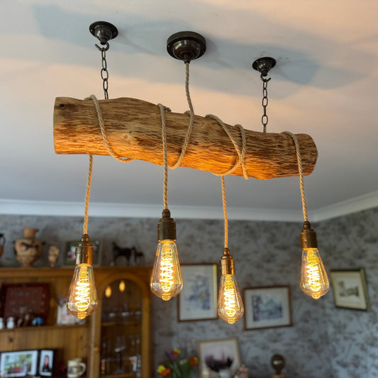 rustic oak log chandelier lighting pendant with cables wrapped around the trunk and four light bulbs