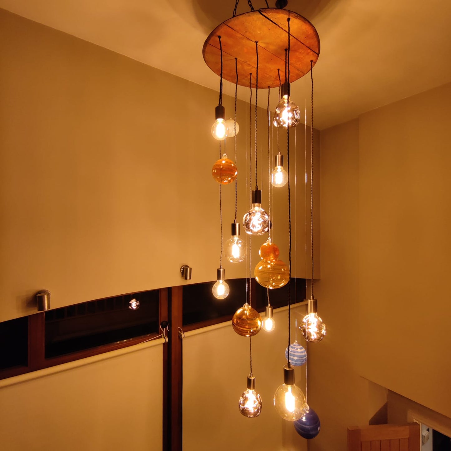 Solar System Chandelier with hanging light bulbs in a room setting